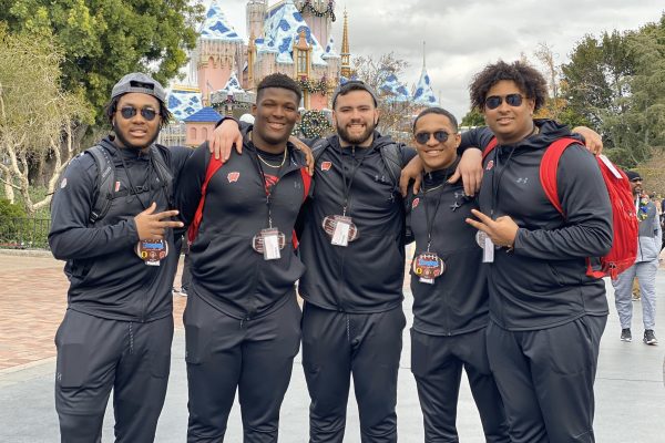 Badger football team members at Disneyland