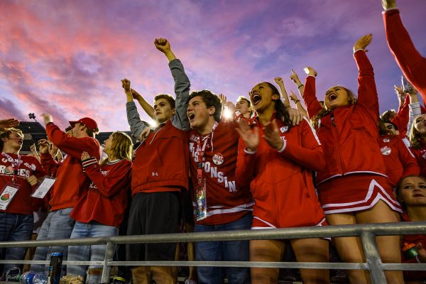 As the sun sets over the stadium, badger fans cheer on the team during the Rose Bowl Game in Pasadena, California on Jan. 1, 2020.
